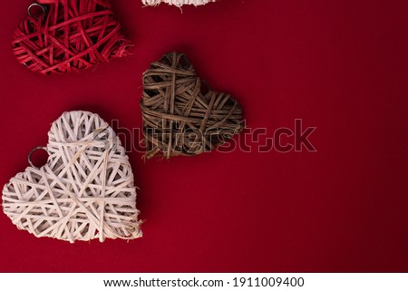 Red, white and brown hearts on red background. St. Valentine's Day, birthday, wedding, engagement and other holiday concept.