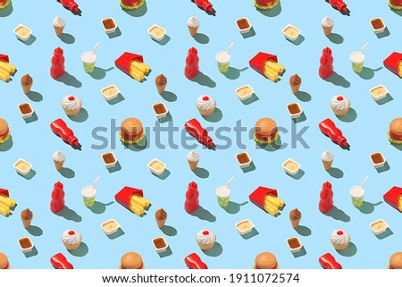 Creative fast food concept. Seamless fast food pattern on a bright blue background.  


