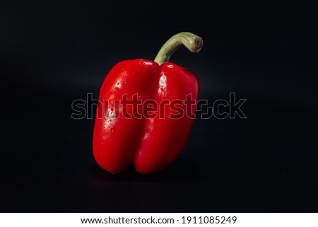 Red, sweet pepper on a black background