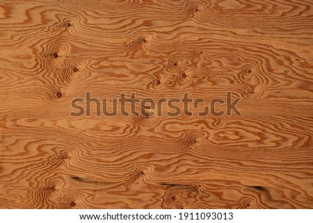 brown wooden surface with many knots inside Royalty-Free Stock Photo #1911093013