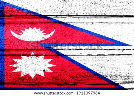 National flag of Nepal, abbreviated with np; a realistic 3d image of the national symbol from an independent country painted on a wooden wall