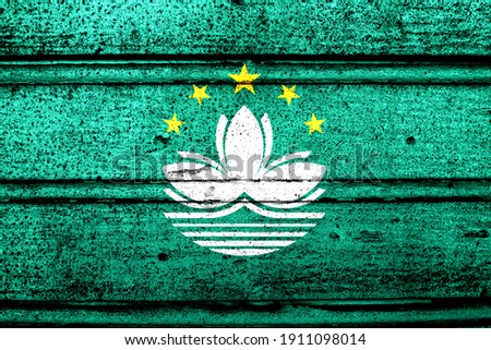 National flag of Macao, abbreviated with mo; a realistic 3d image of the national symbol from an independent country painted on a wooden wall