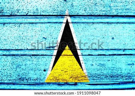 National flag of Saint Lucia, abbreviated with lc; a realistic 3d image of the national symbol from an independent country painted on a wooden wall