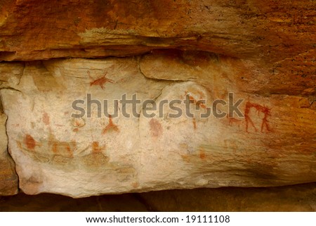 prehistoric social life scenes pictographs. african aborigines - bushmen's (san people) tribal rock ornament in mountains of south africa