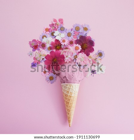 Ice cream cone with Icse cream and flowers. Spring and summer Floral style. Flat lay