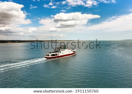 Car ferry in Southampton Water on a beautiful sunny day with clouds in the blue sky. Space for text. Royalty-Free Stock Photo #1911150760