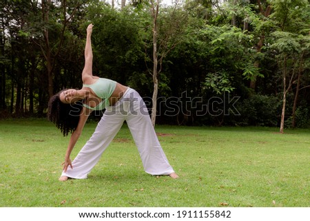 afro woman exercising outdoors. Concept of health and care. Healthy lifestyle
