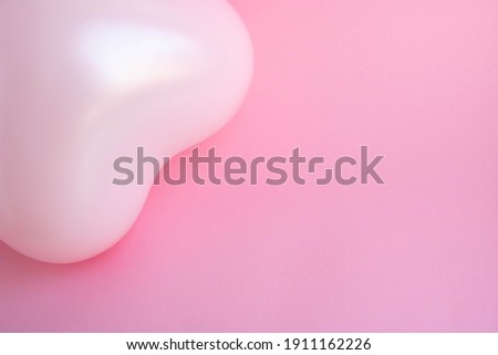 Pink balloon in the shape of a heart on a pink background. Wedding concept, Valentine's Day, photo zone, lovers. Banner. top view. Place for your text.