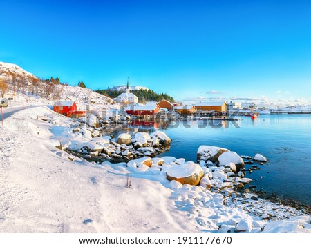 Stunning winter scenery of Moskenes village with ferryport and famous Moskenes parish Church . Popular travel destination on Lofotens.  Location: Sorvagen, Moskenes, Lofoten; Norway, Europe