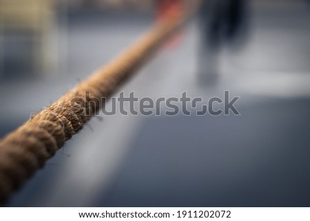 A tightly extended rope as a boundary with the blur's background
