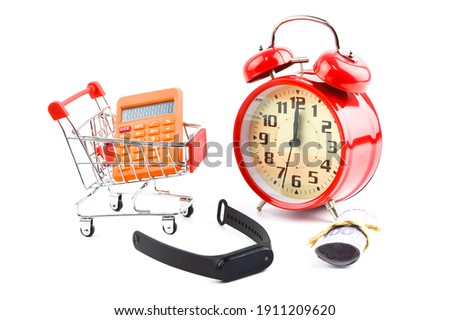 Red alarm clock, money banknote, shopping cart, basket and calculator. Shopping time concept.