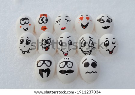 Painted eggs with faces and emotions.