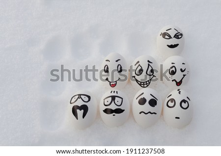 Beautiful painted eggs with faces and emotions.