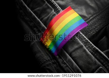 Tag on dark clothing in the form of the flag of the lgbt