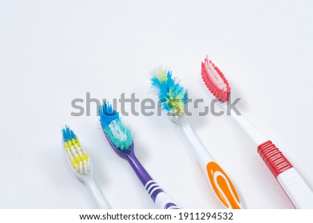 Toothbrushes on empty white background. Royalty-Free Stock Photo #1911294532