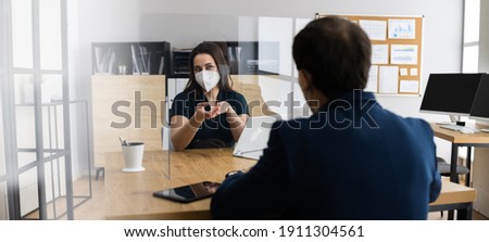 Business Consultant And Insurance Meeting With Sneeze Guard