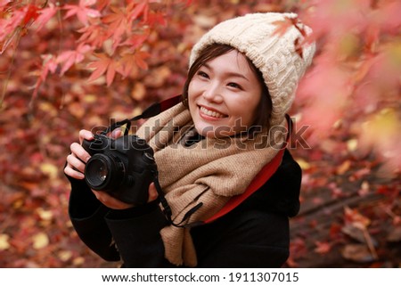 Image of a woman taking a picture
