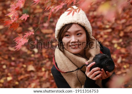 Image of a woman taking a picture