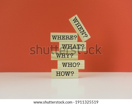 How, Who, Why, What, Where, When Text on Wood Blocks.