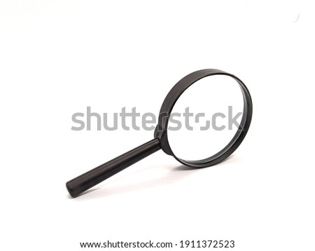 magnifier. one magnifier with black handle on white background. closeup photo side view