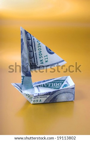 launching money ship, isolated on gold background