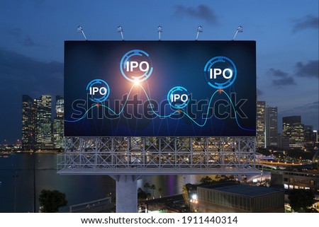 IPO icon hologram on road billboard over night panorama city view of Singapore. The hub of initial public offering in Southeast Asia. The concept of exceeding business opportunities.