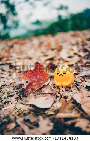 autumn foliage with alone yellow man