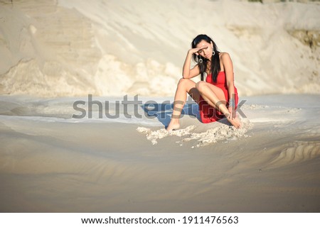 lifestyle photo of woman with perfect hair.walking alone at the beach.Sensual young girl relaxing.Colorful filter.glam style,teen trend outfit, positive mood,smiling,amazing model girl,long hair Royalty-Free Stock Photo #1911476563