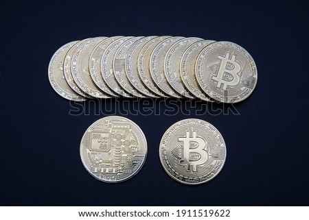 Stacked gold Bitcoin cryptocurrency (BTG). Coins on a dark background. Blockchain technology, Crypto currency, digital money.