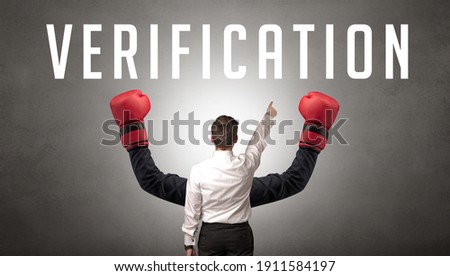 Rear view of a businessman with VERIFICATION inscription, cyber security concept
