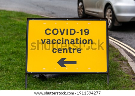 COVID-19 vaccination centre road sign on a street