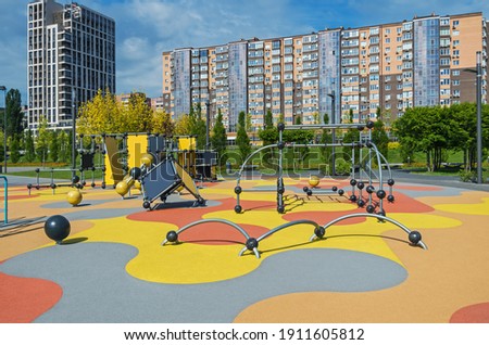 Visibility of colorful large playground in city park. Empty modern outdoor playground in springtime. Beautiful urban place for kids games and sport