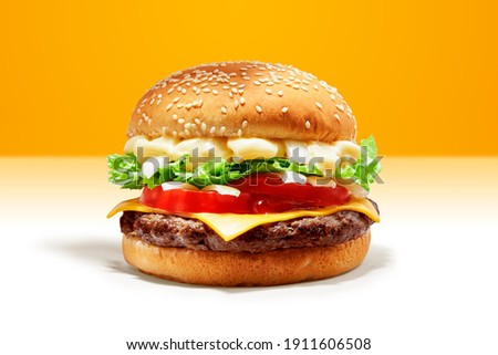 Delicious Beef Burger consists of Bun Bread, Patty, Pickle, Onion, Mayonaisse, Ketchup, Cheddar Cheese and lettuce in a yellow background, with interactive 3D text for Modern Fast Food Restaurant menu