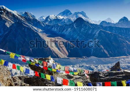 Colorful prayer flags on the Everest Base Camp trek in Himalayas, Nepal. View of Mount Everest and Mountain Peak Nuptse Royalty-Free Stock Photo #1911608071