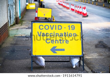 Vaccination Centre for Covid-19 road sign England Royalty-Free Stock Photo #1911614791