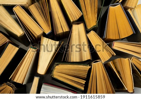 Book background. Old books in the library. Bookshelf shop. Knowledge publications, literature. Bookish bookstore, bookshop. Bookcrossing. Royalty-Free Stock Photo #1911615859