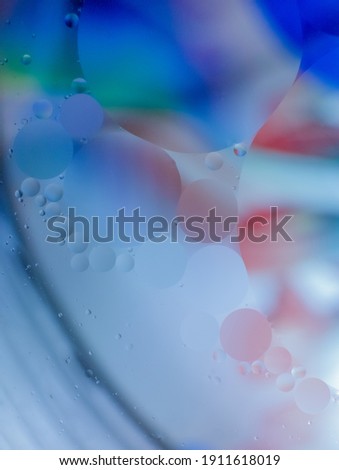 Abstract spheres on blurred background. Oil drops in a water.