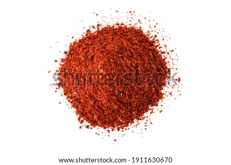 chilli pepper seedless flakes heap isolated on white background. Spices and food ingredients. in Korea known as Gochugaru. Used for Kimchi. Royalty-Free Stock Photo #1911630670
