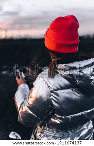 Brunette woman with smartphone winter