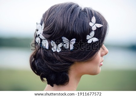 Creative summer hairstyle with butterflies in your hair