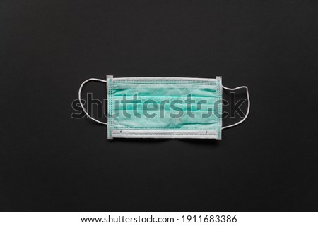 Medical protective mask on a black background. High quality photo