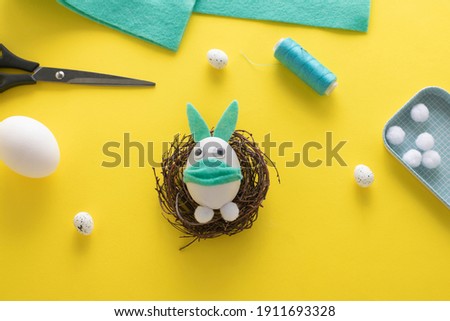 How to make felt bunny for Easter decor and fun.  DIY concept. Step by step photo instruction. Step 15. A funny bunny from an egg in a mask is ready!