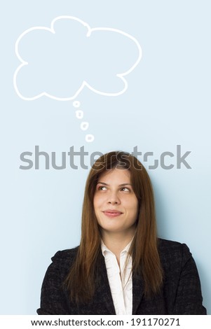 Beautiful business woman smiling and thinking of a brilliant idea with thinking cloud above her head