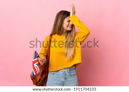 Young blonde woman holding an United Kingdom flag isolated on white background has realized something and intending the solution
