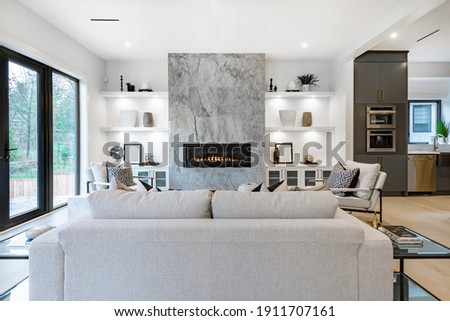 Contemporary home with open concept living and bright white decor Royalty-Free Stock Photo #1911707161