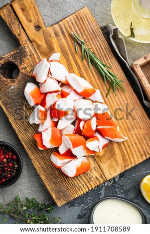 Fresh Crab meat surimi with blue swimming crab set, on gray background, top view flat lay