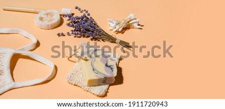 Top view of different hygiene and care items on cream color background, zero waste concept

