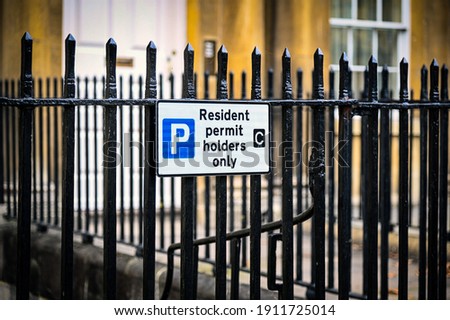 Resident Permit only sign for parking in a residential area 
