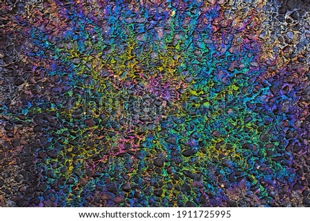 Beautiful colorful abstract picture for background, wallpaper or decoration : rainbow oil spill on asphalt; color photo.