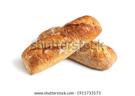Two fresh French mini-baguettes from the bakery, with a delicious crispy crust, isolated on a white background